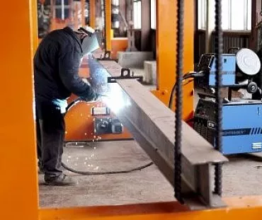 Column made out of black metal (welded plates)